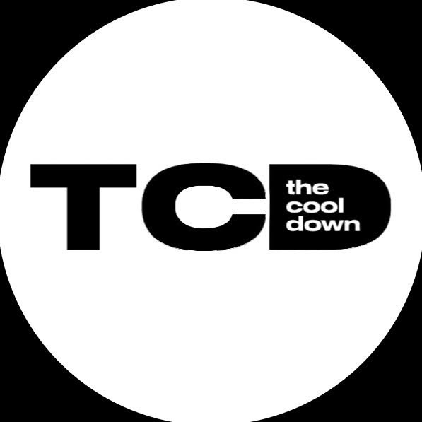The Cool Down TCD logo white harp on dark green background