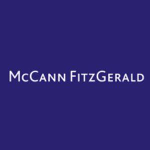McCann Fitzgerald in white print font and a purple background