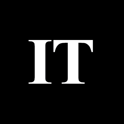 IT in white Times New Roman font on a black background