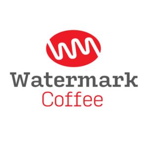 Red circular graphic with coffee bean and life line through it. Watermark Coffee in print.